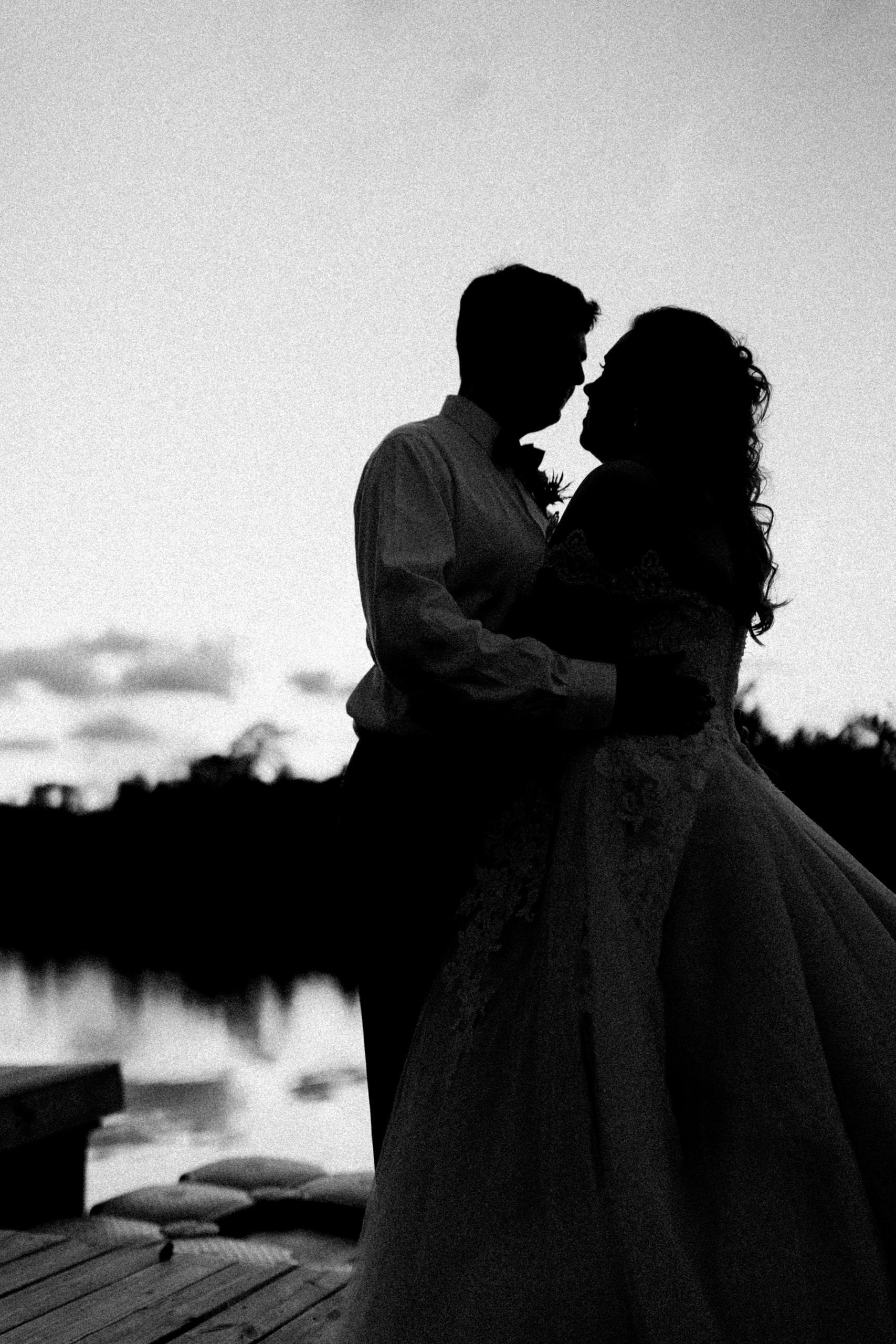 bride and groom sunset portrait at Pascagoula River Audubon Center pier