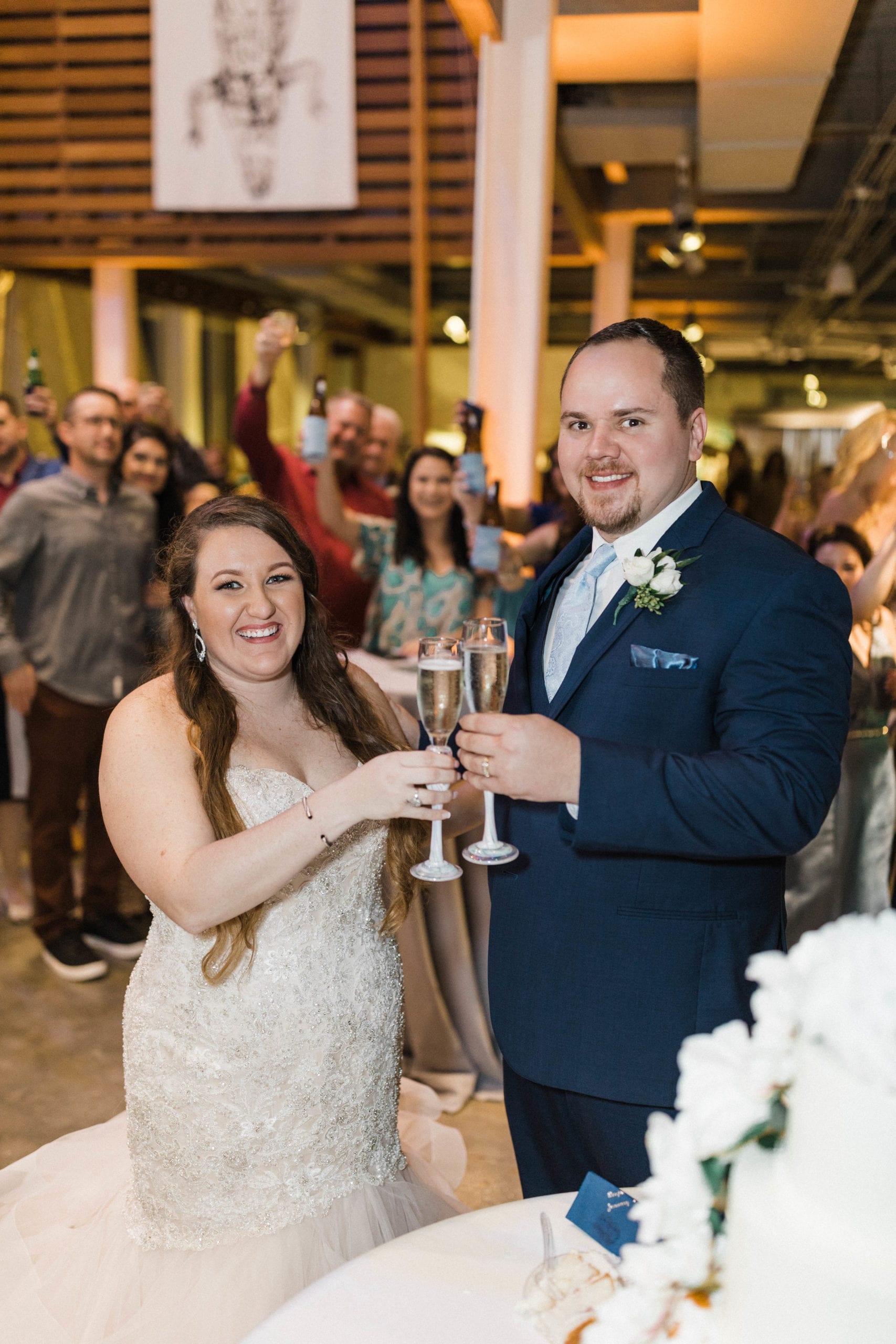 Bride and Groom toasting at Maritime and Seafood Industry Museum wedding reception