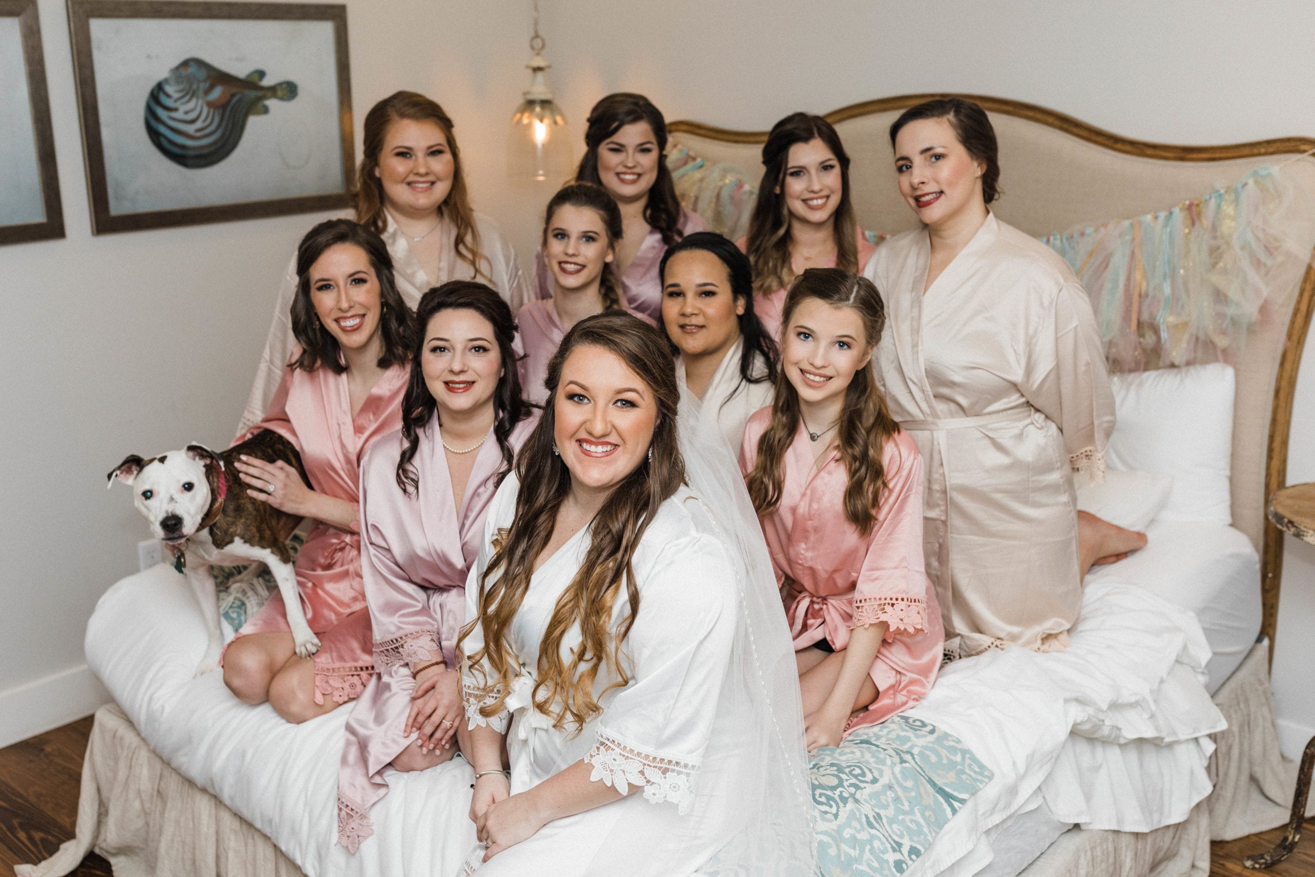 Bridesmaids in matching silk robes The Roost Ocean Springs bridal suite