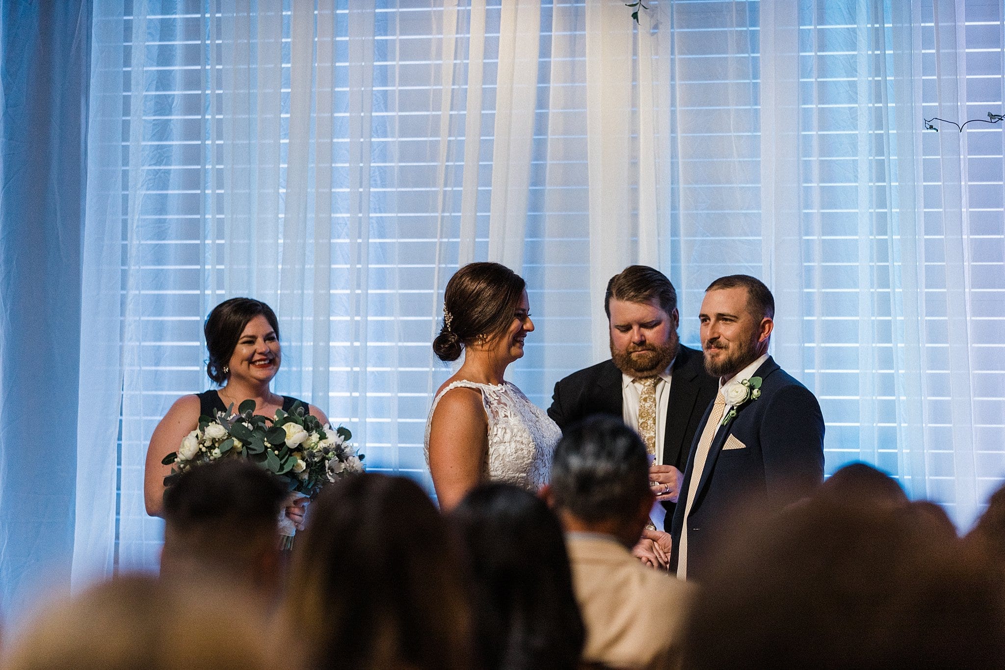 sharing vows at wedding ceremony at Jackson Pearl