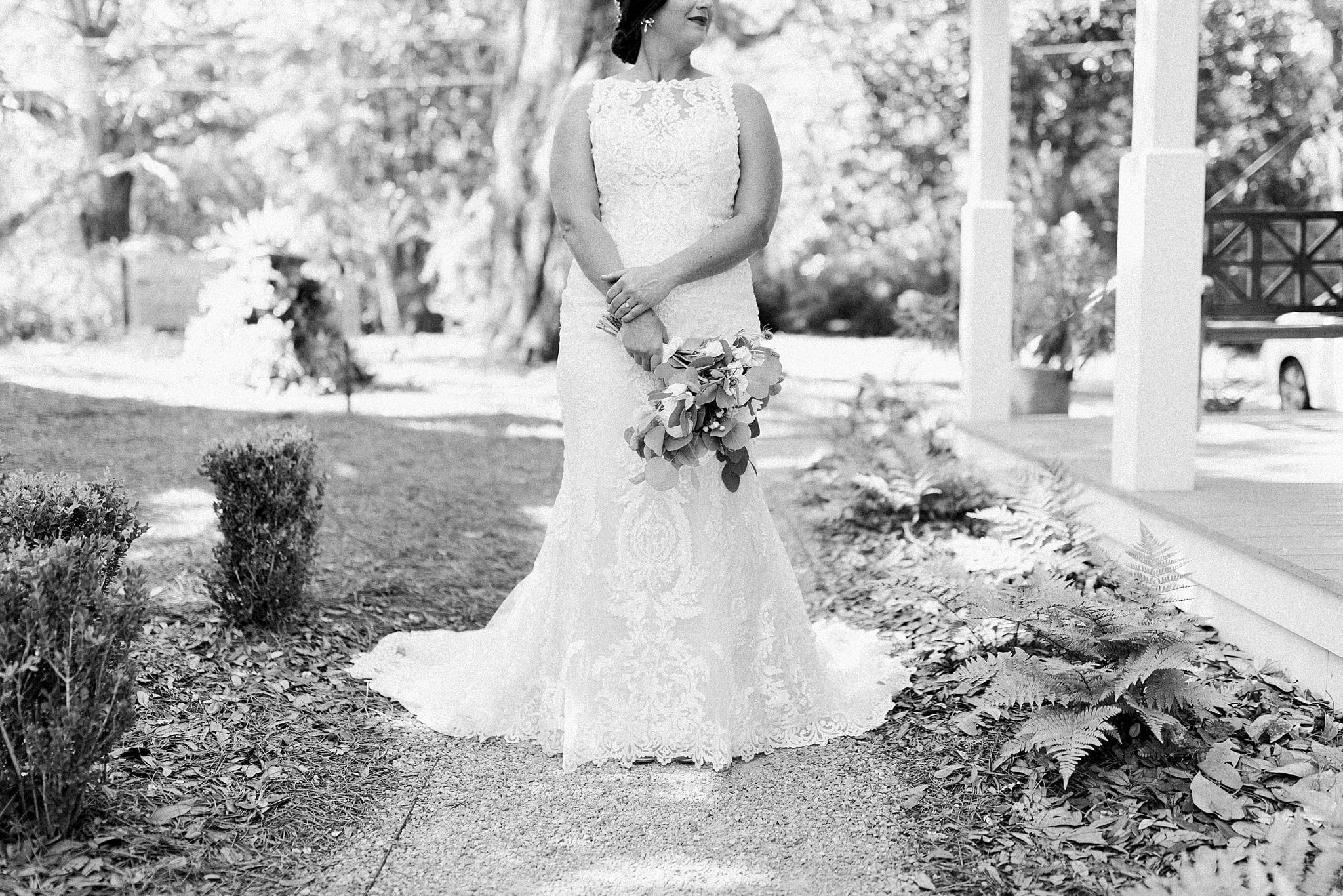 classic black and white of bride's wedding gown and flowers