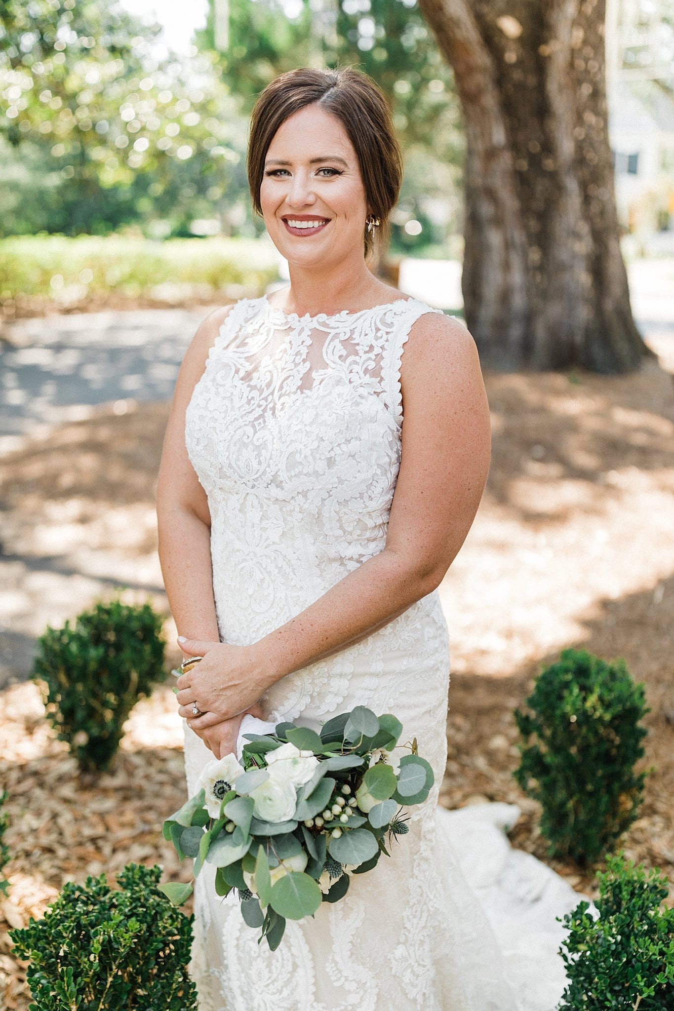 smiling bride holding bouquet