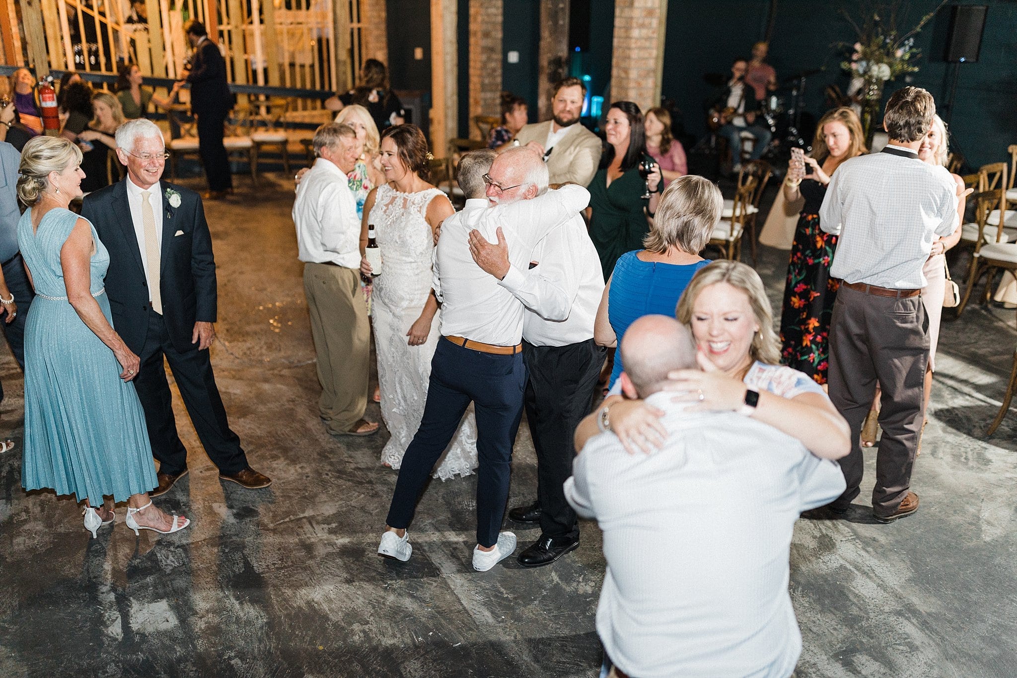 wedding guests on dance floor at reception