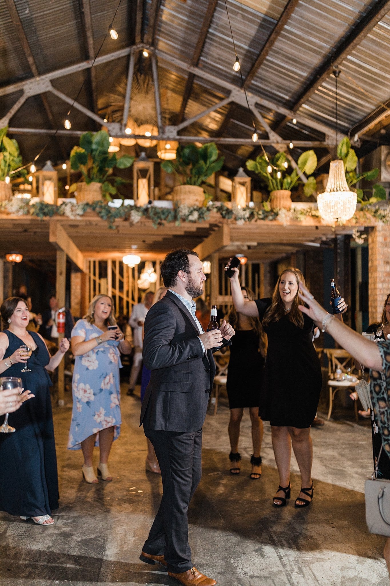 guests dancing to live band at wedding reception