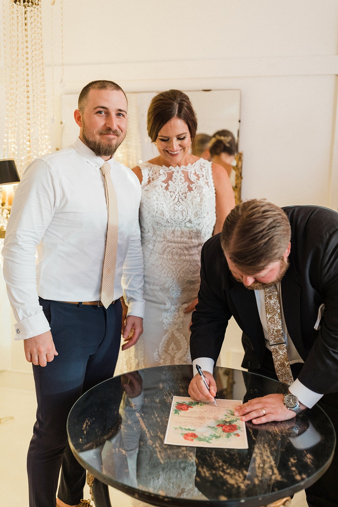 wedding officiant signing marriage license