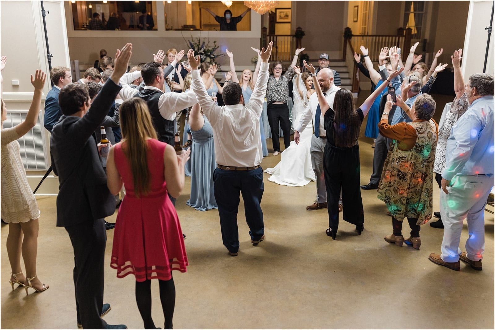 guests dancing to YMCA at the wedding reception